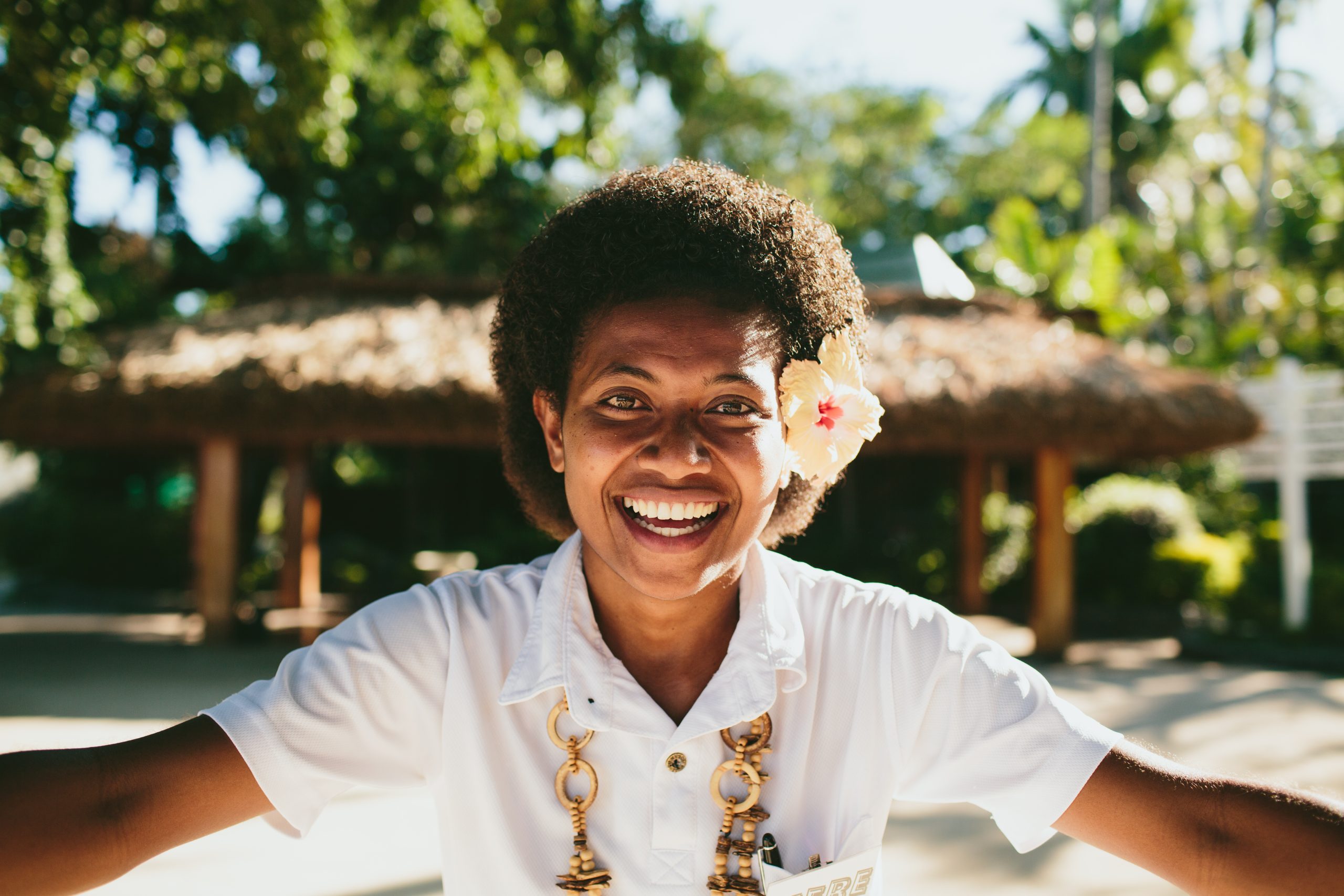 Turtle Island staff member representing the Fijian community and welcoming guests to the resort